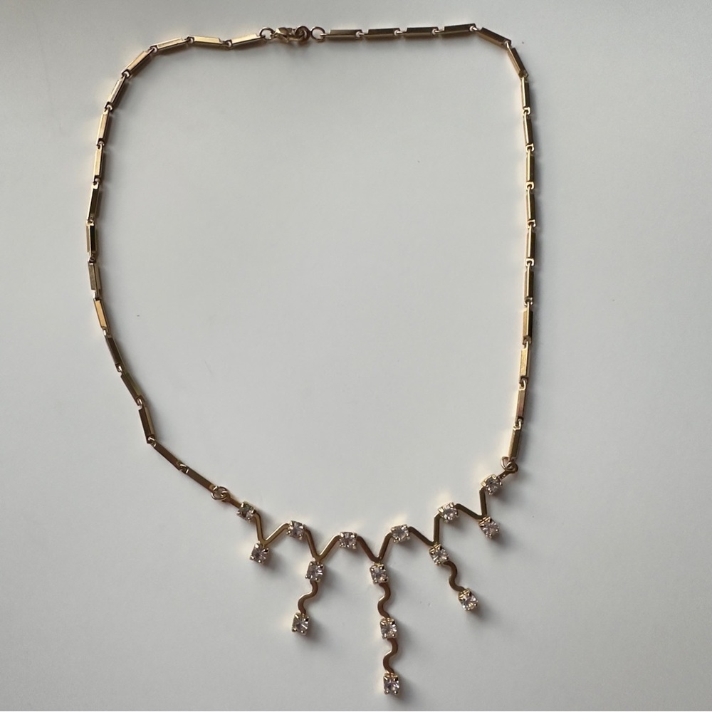 Gold Tone Stamped Eva with crystals Necklace